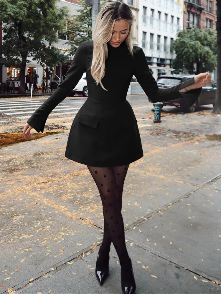 Long-sleeve bodycon mini dress with zipper and pockets.